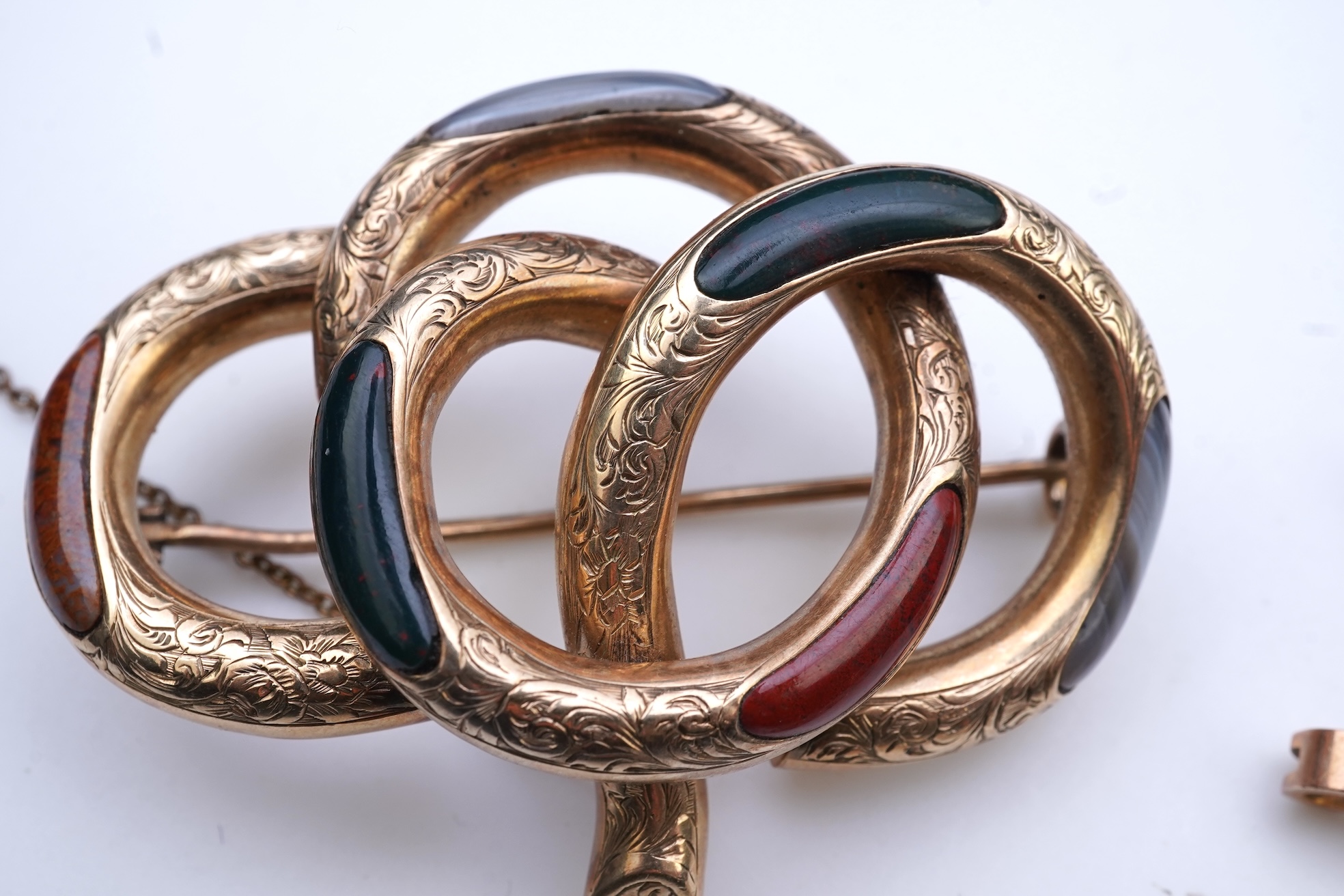 Four brooches and a gold signet ring